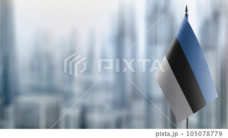 Small flags of the Estonia on an abstract blurry background Small flags of the Estonia on an abstract blurry background 105078779