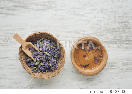 Essential lavender oil and flowers on table with copy space Essential lavender oil and flowers on table with copy space 105079869