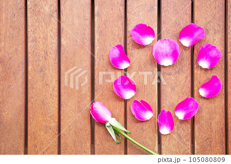 Background of pink heart from fresh pink rose petals. Valentines day concept. Copy space. Background of pink heart from fresh pink rose petals. Valentines day concept. Copy space. 105080809