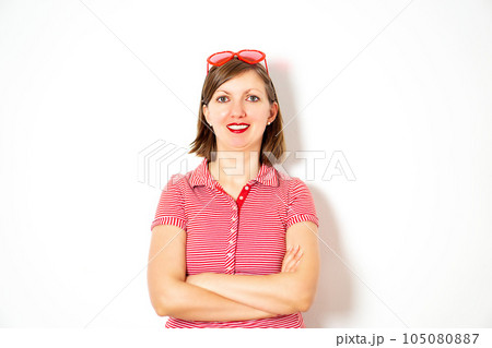 Portrait of the young smiling attractive woman with red heart sunglasses on the white background. Portrait of the young smiling attractive woman with red heart sunglasses on the white background. 105080887