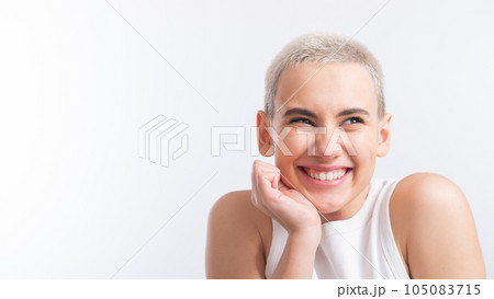 Pretty young woman with a short blond haircut on a white background. Pretty young woman with a short blond haircut on a white background. 105083715