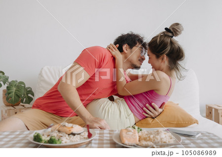 Romantic couple lover hugging each other after back home for dinning. Romantic couple lover hugging each other after back home for dinning. 105086989