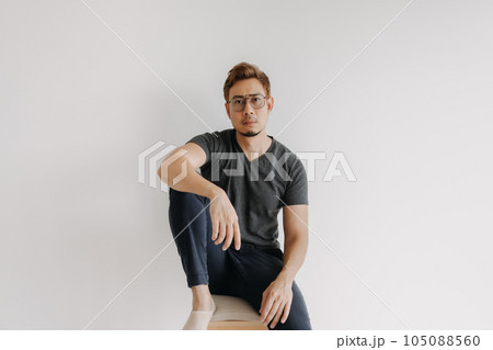 Cool man gangster style sitting in black t-shirt isolated on white. 105088560