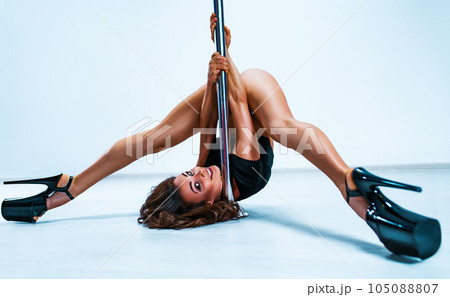 Woman pole dancing Woman pole dancing 105088807