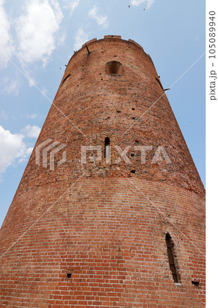 Belaya Vezha tower. From red brick. Against the background of the sky. Belaya Vezha tower. From red brick. Against the background of the sky. 105089940