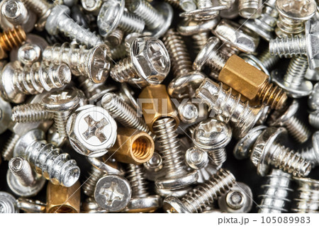 Close-up of Small bolts for computer equipment and computer assembly Close-up of Small bolts for computer equipment and computer assembly 105089983