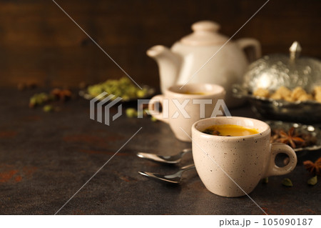 Traditional Indian hot drink with milk and spices - Masala tea Traditional Indian hot drink with milk and spices - Masala tea 105090187