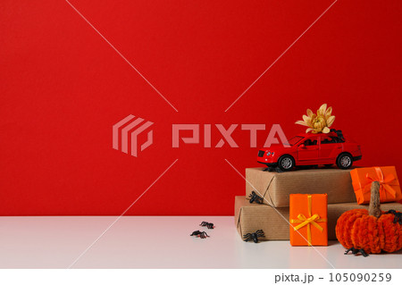 Autumn or fall travel and vacation concept with car 105090259