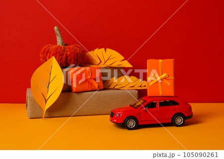 Autumn or fall travel and vacation concept with car 105090261