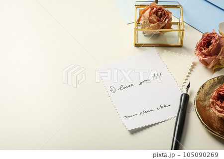 Letter with words I love you!!!, roses and paper sheets on white background, space for text Letter with words I love you!!!, roses and paper sheets on white background, space for text 105090269