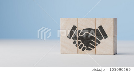 Handshaking icon on wood cube block. teamwork, brainstorming, cooperation business deal and agreement, and business success concept. copy space 105090569