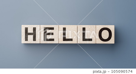 Hello salutation or greeting word to welcome someone or initiate conversation. Banner with letters on wooden cubes over blue background. 105090574