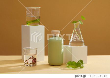 Glassware of seaweed are placed on podiums, arranged with unlabeled bottle. Seaweed helps hydrate and plump your skin for a more supple, bounce complexion Glassware of seaweed are placed on podiums, arranged with unlabeled bottle. Seaweed helps hydrate and plump your skin for a more supple, bounce complexion 105094048