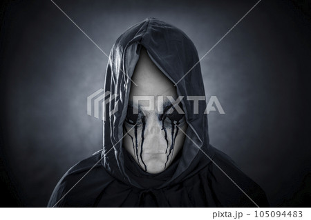 Mysterious humanoid alien in blood at night over dark misty background 105094483