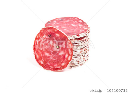 Slices of salami sausage on a white background 105100732