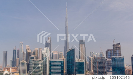 Aerial view to Dubai Business Bay and Downtown with the various skyscrapers and towers timelapse 105102146