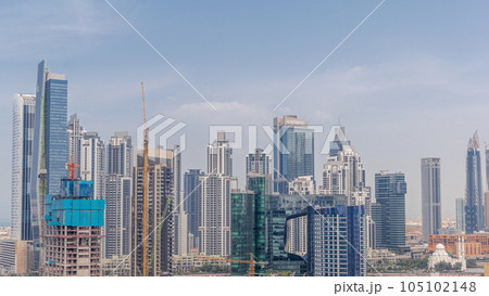 Cityscape with skyscrapers of Dubai Business Bay and water canal aerial timelapse. 105102148