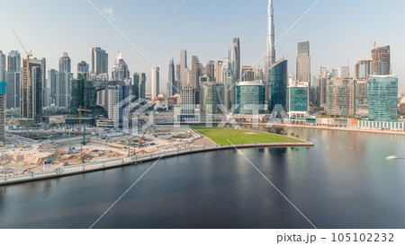 Aerial view to Dubai Business Bay and Downtown with the various skyscrapers and towers timelapse Aerial view to Dubai Business Bay and Downtown with the various skyscrapers and towers timelapse 105102232
