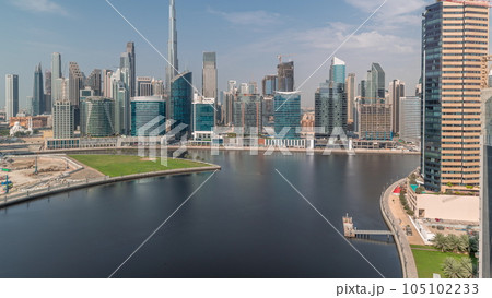 Aerial view to Dubai Business Bay and Downtown with the various skyscrapers and towers timelapse 105102233