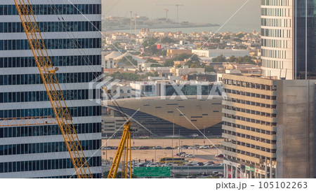 Skyscrapers and privat houses near Business Bay Metro Station alongside Sheikh Zayed Road in Dubai timelapse. 105102263