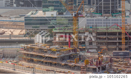Large construction site with many working cranes timelapse. 105102265