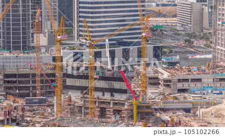 Large construction site with many working cranes timelapse. 105102266