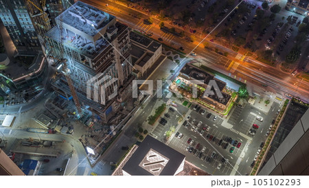 Construction site and parking lot near in financial district in Dubai aerial timelapse, UAE. 105102293