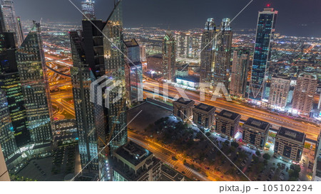 High-rise buildings on Sheikh Zayed Road in Dubai aerial night timelapse, UAE. High-rise buildings on Sheikh Zayed Road in Dubai aerial night timelapse, UAE. 105102294