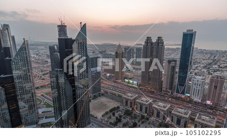 High-rise buildings on Sheikh Zayed Road in Dubai aerial day to night timelapse, UAE. High-rise buildings on Sheikh Zayed Road in Dubai aerial day to night timelapse, UAE. 105102295