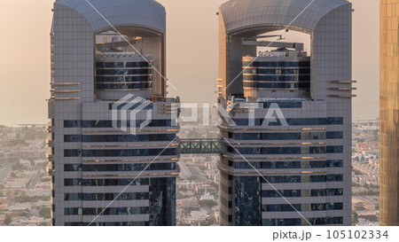Close up view of the high-rise buildings on Sheikh Zayed Road in Dubai aerial timelapse, UAE. Close up view of the high-rise buildings on Sheikh Zayed Road in Dubai aerial timelapse, UAE. 105102334