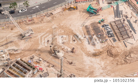 Aerial view construction site with a foundation pit of new skyscraper timelapse. Aerial view construction site with a foundation pit of new skyscraper timelapse. 105102356