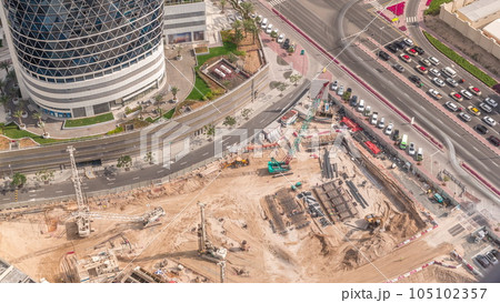 Aerial view construction site with a foundation pit of new skyscraper timelapse. Aerial view construction site with a foundation pit of new skyscraper timelapse. 105102357