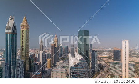 Skyline view of the high-rise buildings on Sheikh Zayed Road in Dubai aerial timelapse, UAE. Skyline view of the high-rise buildings on Sheikh Zayed Road in Dubai aerial timelapse, UAE. 105102430
