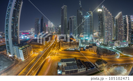 Aerial view of Dubai Downtown skyline with many towers night timelapse. Aerial view of Dubai Downtown skyline with many towers night timelapse. 105102471