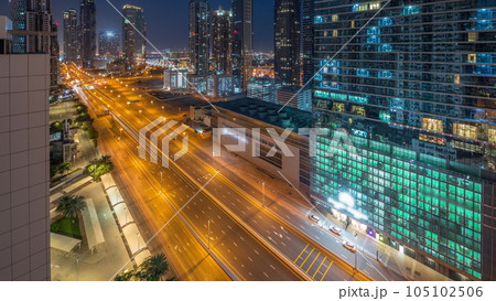 Business bay district skyline with modern architecture night to day timelapse from above. 105102506