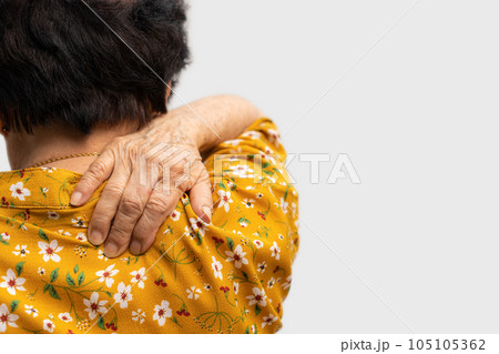 Sick senior woman with back neck and shoulders pain on the joint and muscle. Close-up of wrinkled hands rubbing their neck-collar area, osteoarthritis, neurological diseases. Medicine concept Sick senior woman with back neck and shoulders pain on the joint and muscle. Close-up of wrinkled hands rubbing their neck-collar area, osteoarthritis, neurological diseases. Medicine concept 105105362