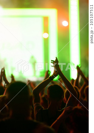 Hand with a phone records live music festival. People taking photographs with smart phone. Hand with a phone records live music festival. People taking photographs with smart phone. 105107511