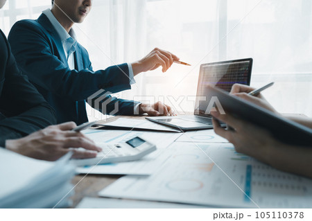 startup business, business advisor explaining strategy for planning finance investment teamwork paperwork audit and discussing marketing, profit, budget of company in meeting room startup business, business advisor explaining strategy for planning finance investment teamwork paperwork audit and discussing marketing, profit, budget of company in meeting room 105110378