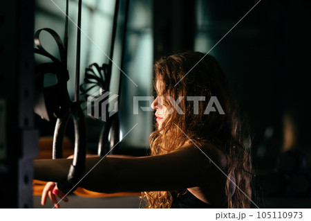 Athletic Beautiful Woman at gym. Close up portrait Athletic Beautiful Woman at gym. Close up portrait 105110973