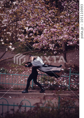 Beautiful young woman wearing kimono with cherry blossoms, sakura view 105110993