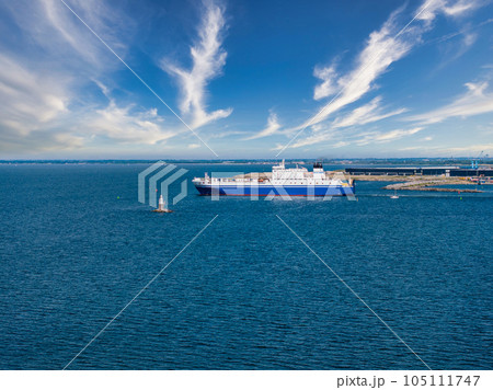 Industrial ship crossing the canal moving towards Malmo bridge between Sweden and Denmark. 105111747