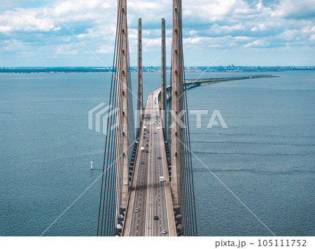 Panoramic aerial close up view of Oresund bridge over the Baltic sea between Malmo city in Sweden and Copenhagen in Denmark. 105111752