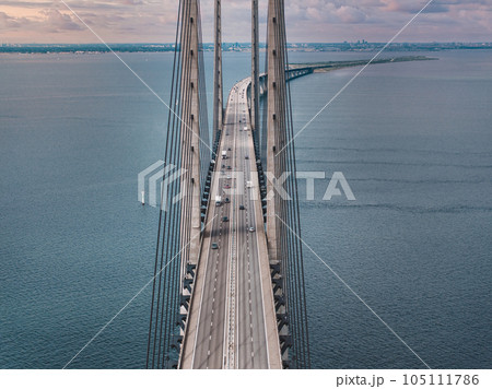 Panoramic aerial close up view of Oresund bridge over the Baltic sea between Malmo city in Sweden and Copenhagen in Denmark. 105111786