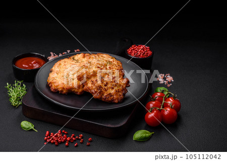 Delicious fresh fried minced chicken meat cutlets with salt, spices and herbs 105112042