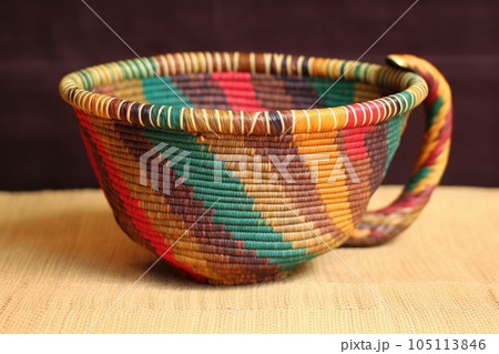 handwoven colorful basket, or mesob, used for serving coffee, created with generative ai 105113846