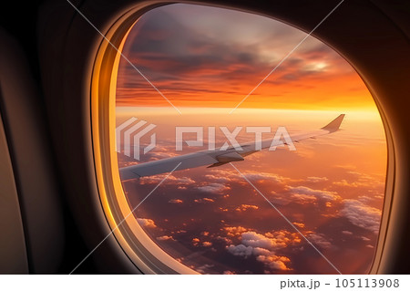 Traveling by airplane: sunset view from the window. 105113908