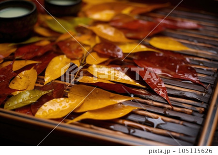 close-up of freshly plucked tea leaves on bamboo tray, created with generative ai 105115626