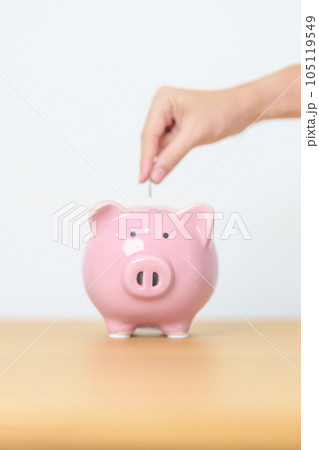 Money Saving for Future Plan, Retirement fund, Pension, Investment, Wealth Business and Financial concepts. hand holding and putting into piggy bank, Money Counting for World Savings day and Donate 105119549