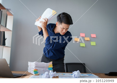 Portrait of business owner, man using computer and financial statements Anxious expression on expanding the market to increase the ability to invest in business Portrait of business owner, man using computer and financial statements Anxious expression on expanding the market to increase the ability to invest in business 105120949
