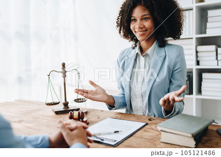 Portrait of african american woman lawyer studying lawsuit a for a discussing client documents law data before going to court Portrait of african american woman lawyer studying lawsuit a for a discussing client documents law data before going to court 105121486
